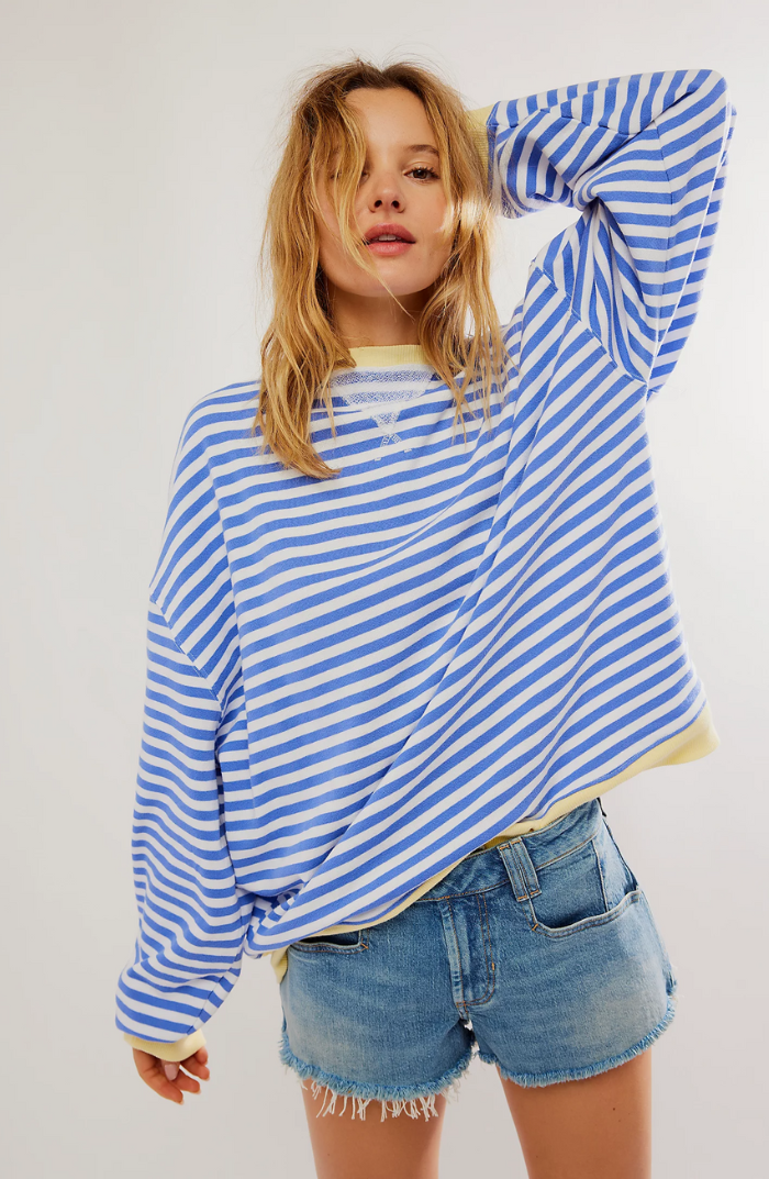 Soft long sleeve women's sweater featuring a classic striped pattern and cozy crewneck design, ideal for casual outfits.