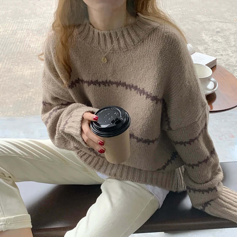 Soft knit women's striped sweater, a cozy round neck long sleeve top for comfortable everyday wear.