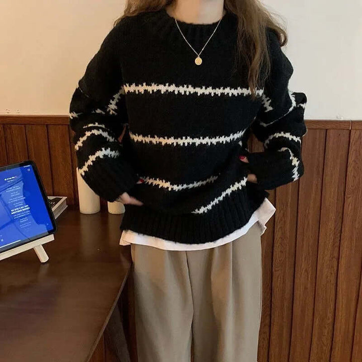 Cozy women's striped knitted round neck sweater, soft long sleeve design for comfortable fall fashion.
