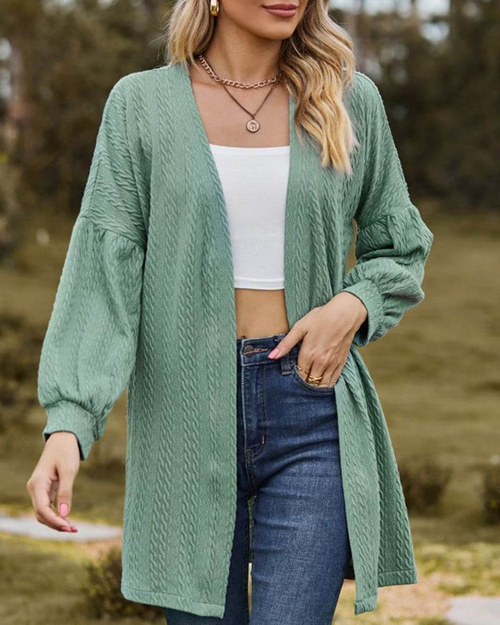 Women's cozy textured knit cardigan with stylish lantern sleeves, perfect for fall layering.