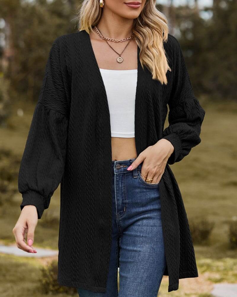 Fall/winter women's layering cardigan. Cozy textured knit with fashionable lantern sleeves for chic warmth.
