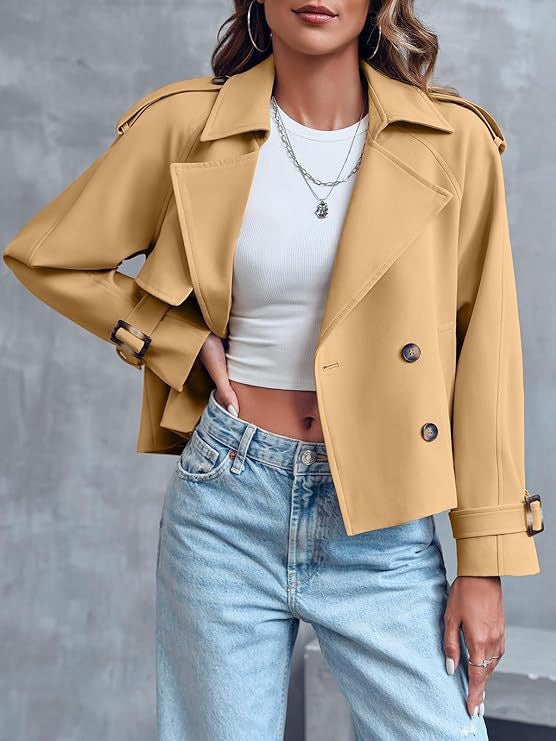 Elegant women's double-breasted short trench coat. Stylish cropped jacket, ideal outerwear for modern fashion.
