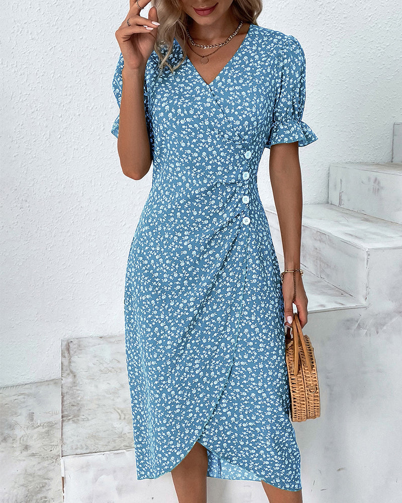 Close-up: comfortable, flowy fabric on a women's floral print v-neck summer dress, showing print detail.
