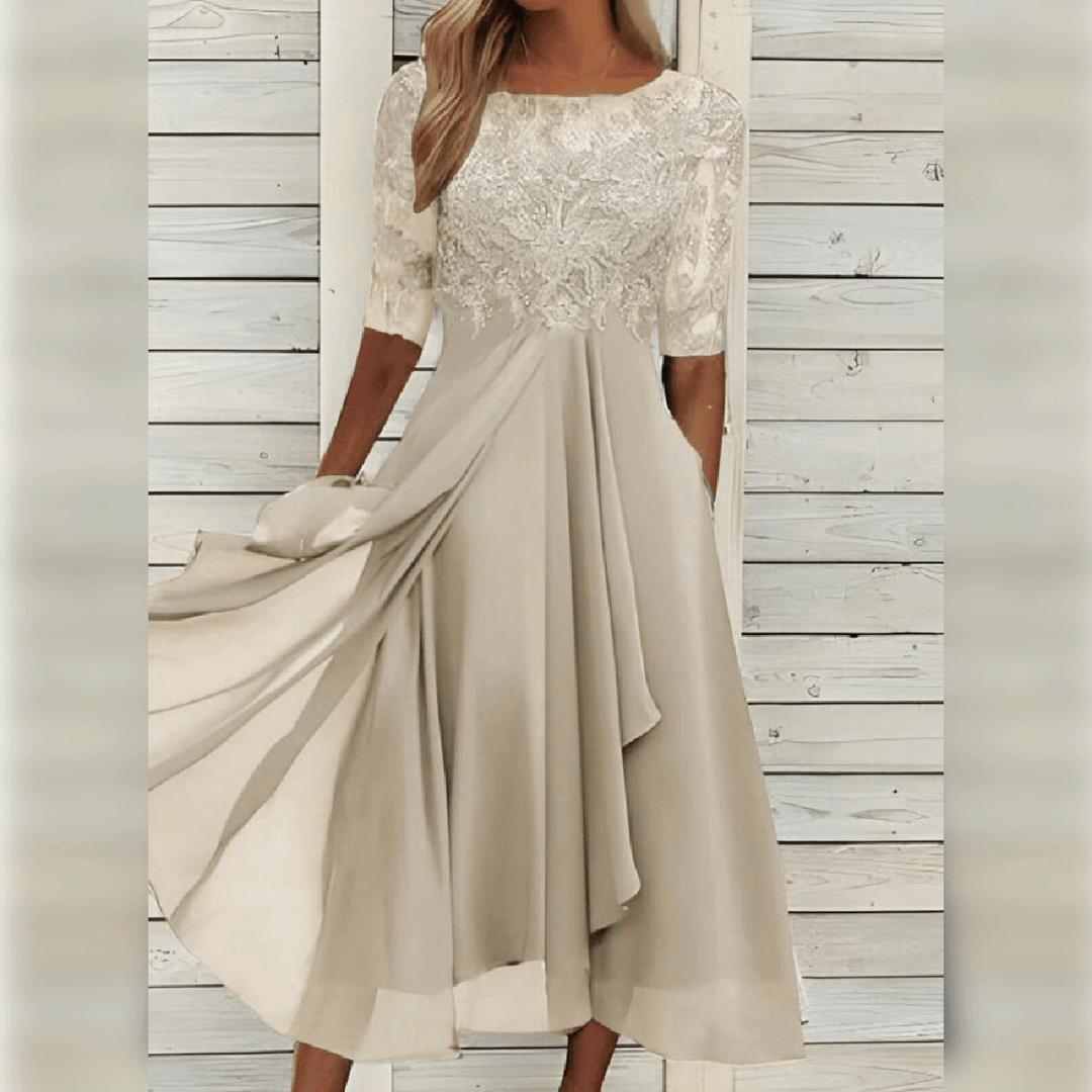 Close-up of the intricate lace bodice on an elegant women's formal midi dress, occasion wear.