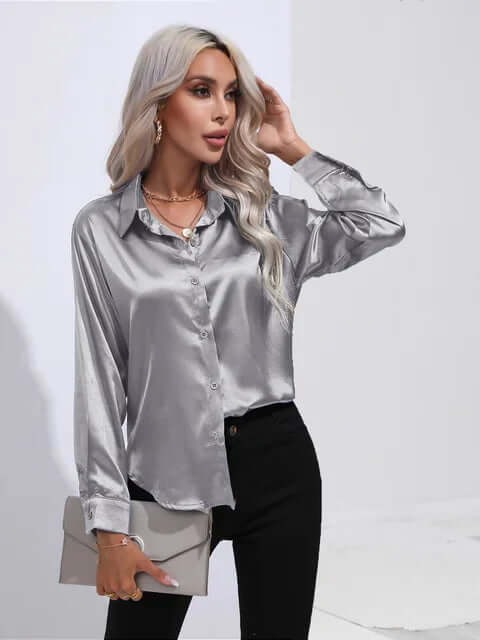 Luxurious women's satin long sleeve blouse. Elegant loose fit top for versatile fashion.