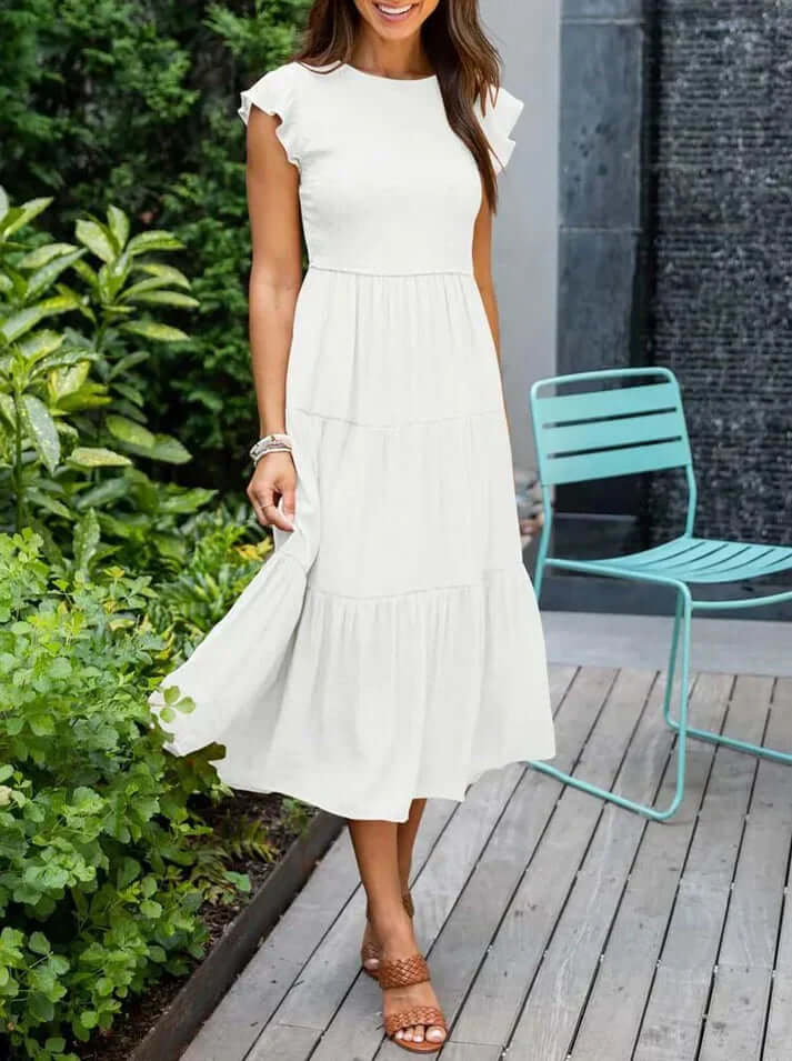 Stylish women's A-line midi dress featuring fine pleats & flowing flutter sleeves. Ideal for summer elegance & comfort.