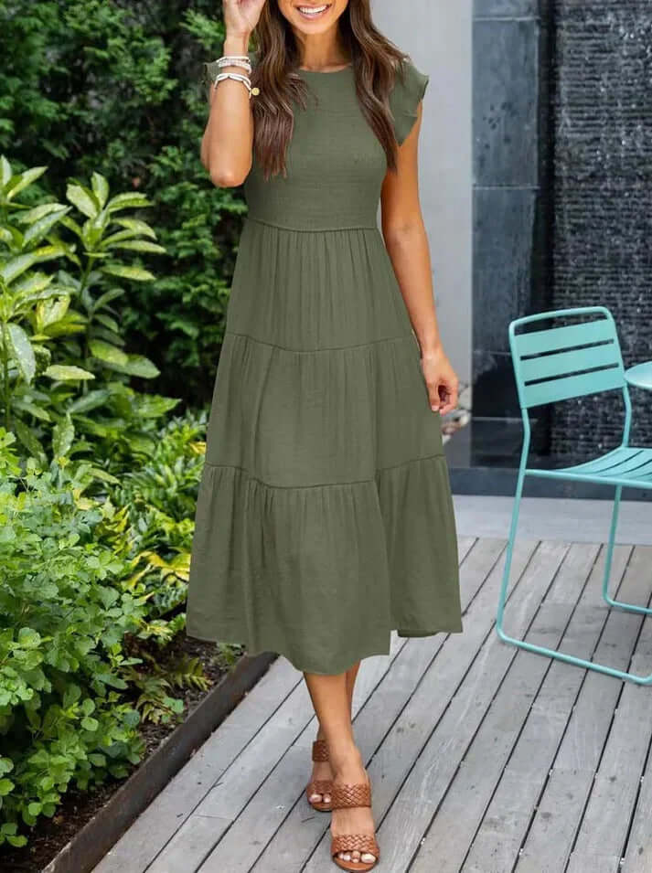 Fashionable women's midi A-line dress with flattering pleats & soft flutter sleeves, designed for versatile wear.