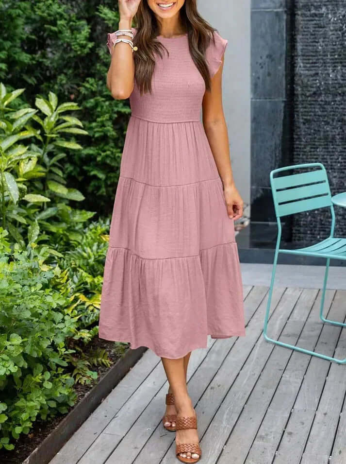 Sophisticated women's pleated A-line midi dress featuring delicate flutter sleeves, a perfect elegant summer outfit.