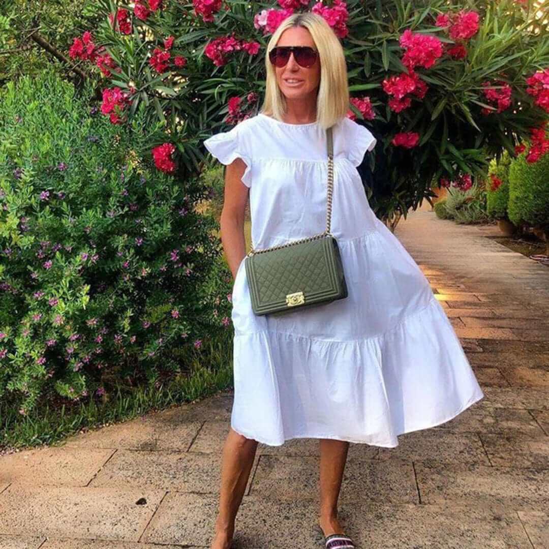 Versatile women's ruffled midi dress for summer. Elegant sleeveless style, perfect for casual outings or parties.