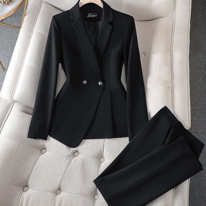 Two-piece women's elegant power suit featuring a fitted blazer and straight-leg trousers for formal office attire.