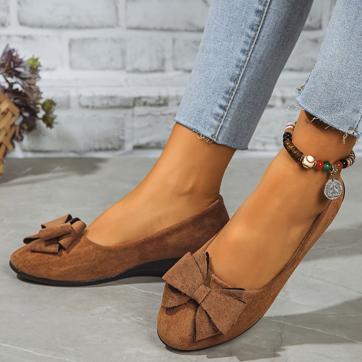 Stylish women's wedge ballet flats, slip-on comfort and pretty bow.
