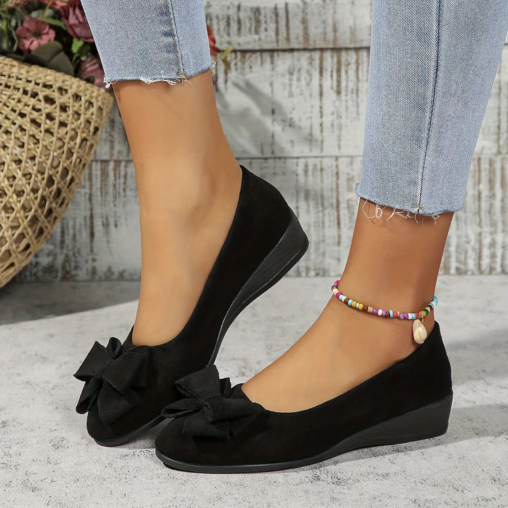 Versatile women's ballet wedge flats, stylish with a delicate bow accent.