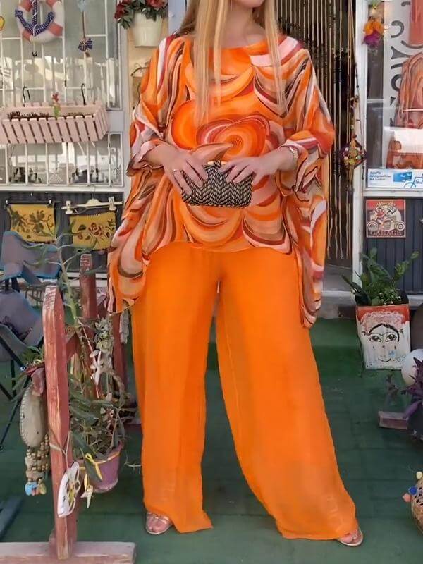Elegant women's chiffon top & wide-leg pants set, perfect for versatile summer style.