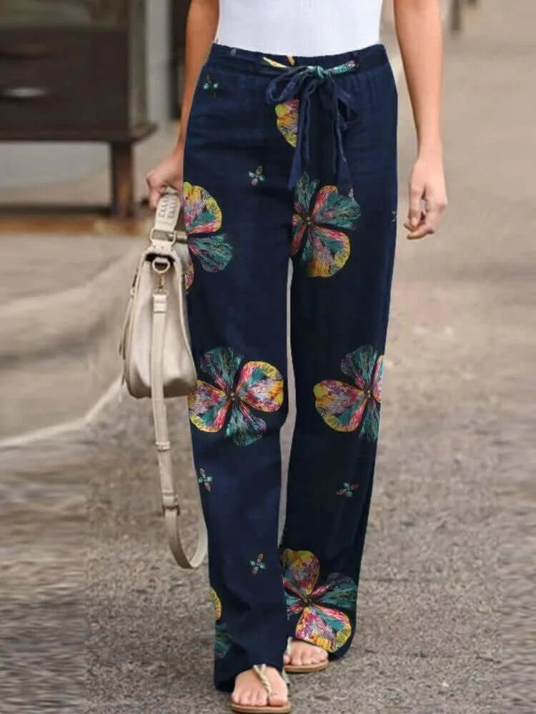 Boho floral wide-leg pants for women featuring a drawstring waist & breezy fabric. Perfect for summer.