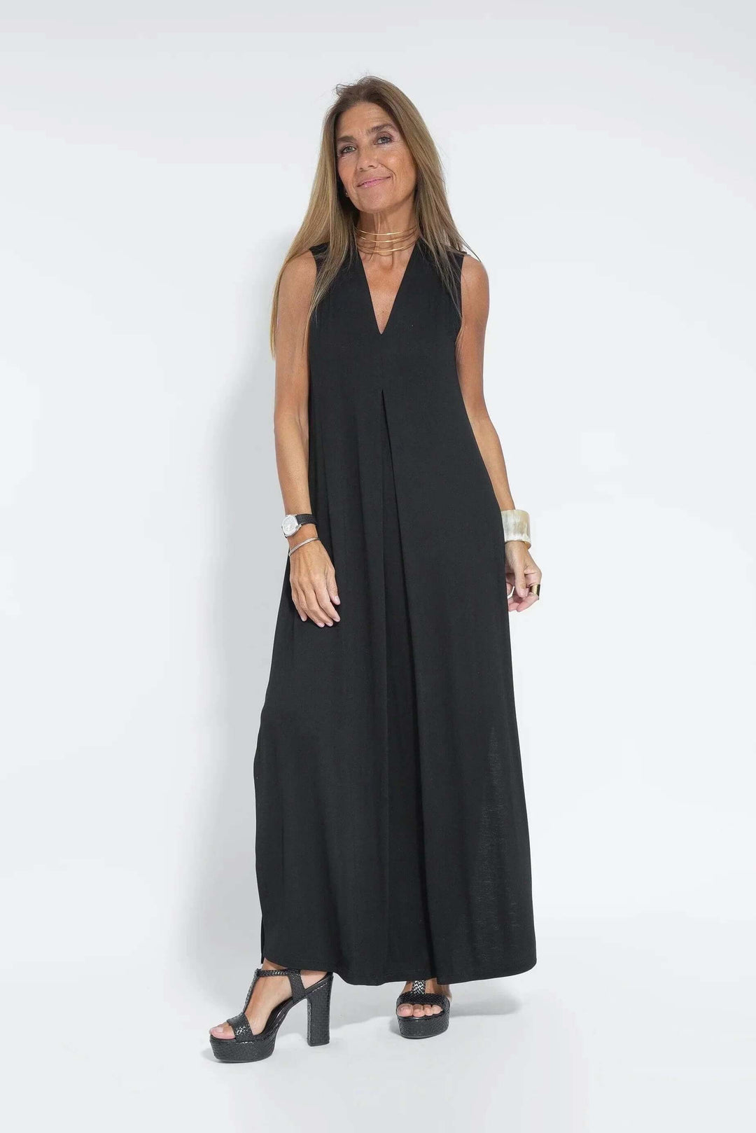 Women's flowy maxi dress & cardigan set. Comfortable two-piece outfit for versatile spring/summer style.