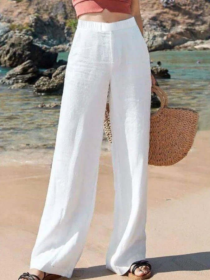 Women's flowy wide-leg linen trousers. Breathable, comfortable for summer casual wear.