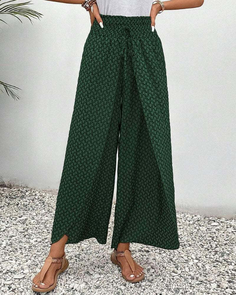 Chic green women's wide-leg flowy pants with elastic waist, ideal for summer fashion & vacation wear.