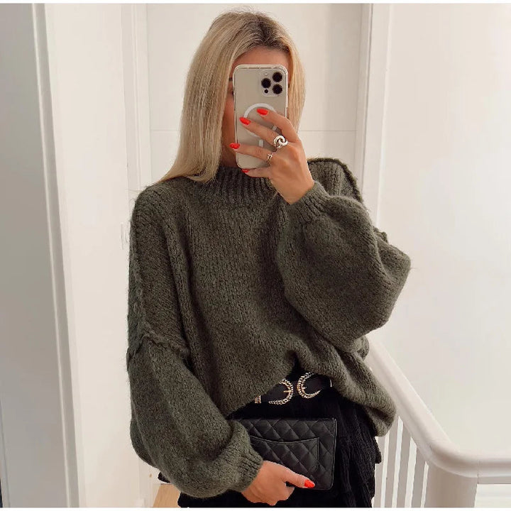 Women's cozy oversized fluffy knit sweater. Warm, long sleeve, and stylish for casual winter fashion.