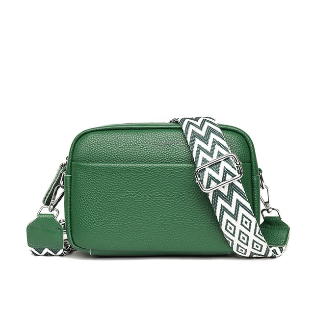 Close-up of the clasp closure on a women's luxe genuine leather crossbody shoulder bag.