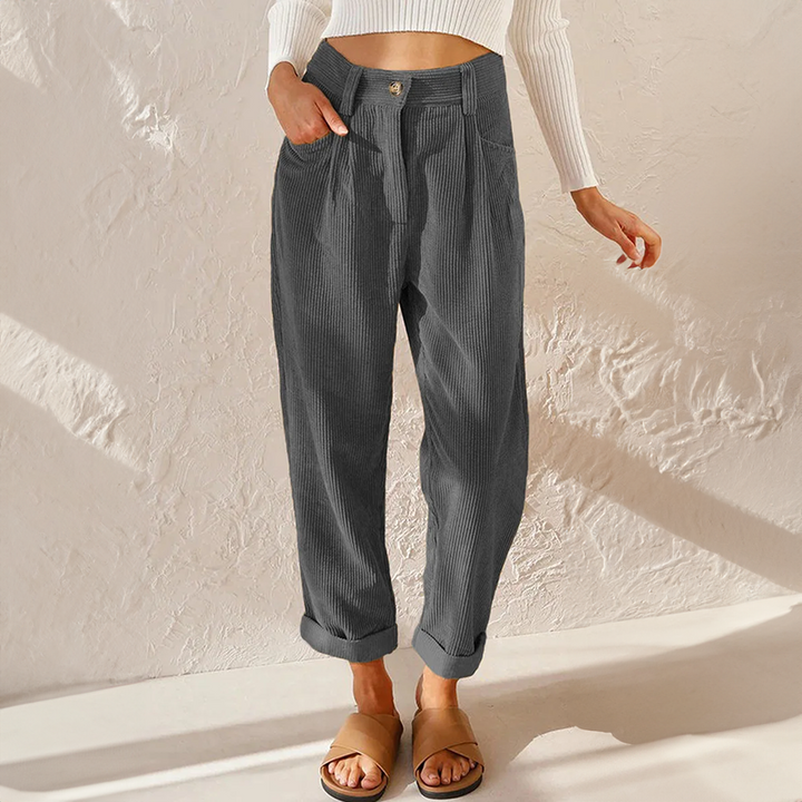 Comfortable womenswear: relaxed tapered leg pants, high waist, pleated design for classic style.