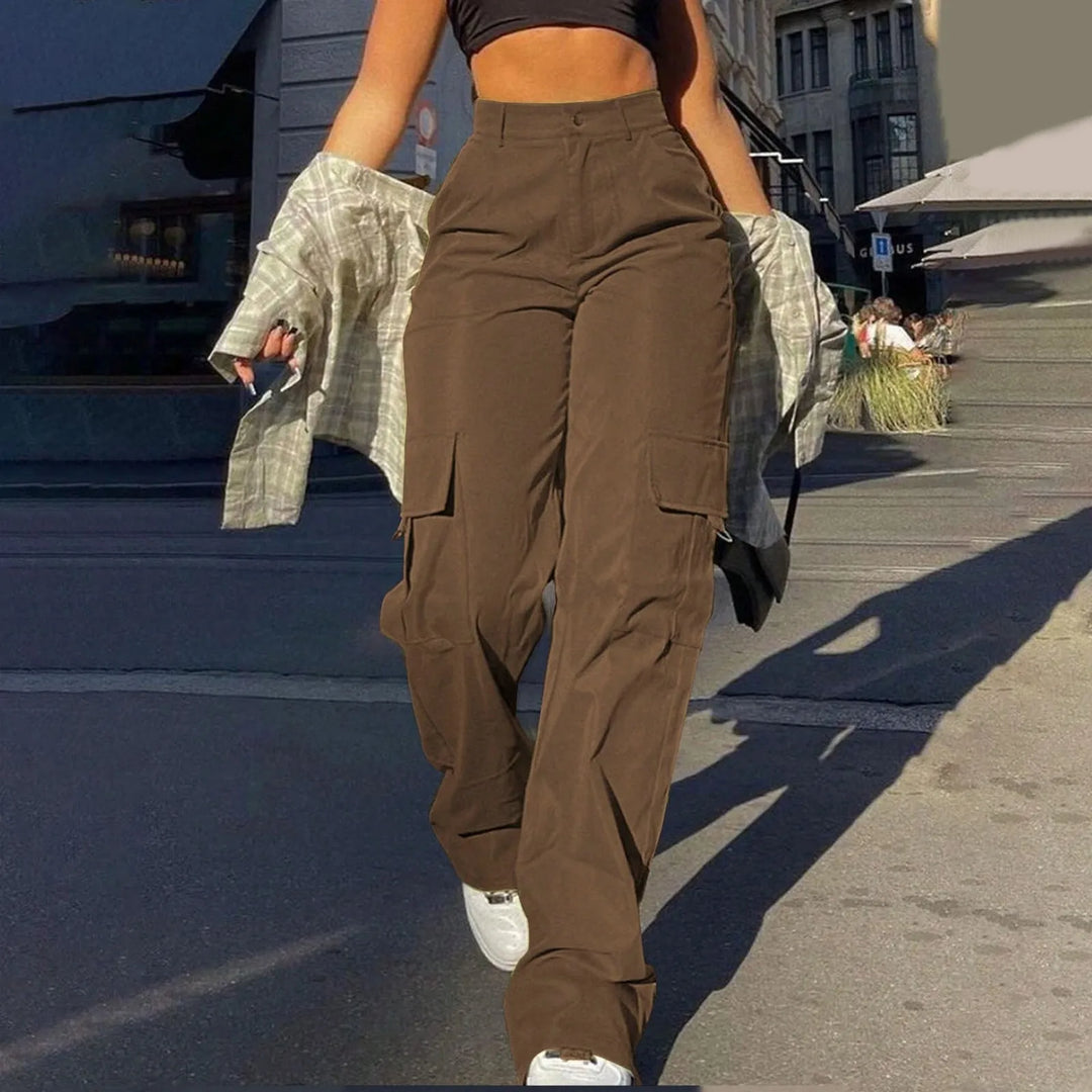 Women's high-waisted baggy cargo pants with multiple utility pockets for a modern street style look.