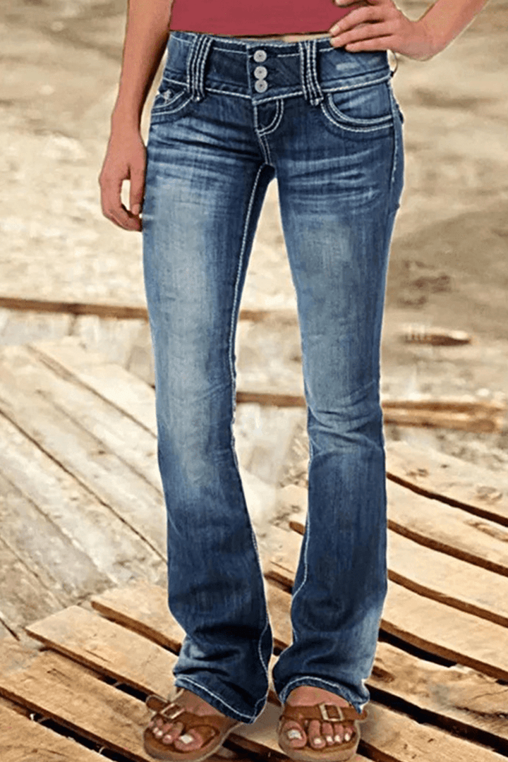Flattering women's high-rise bootcut denim jeans with fashionable rips. Perfect for casual wear & trendy style.