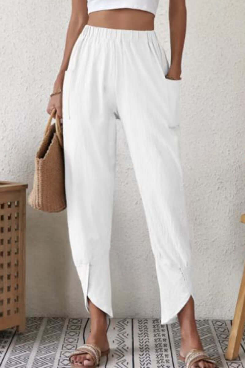 Versatile women's high-waisted Harlan pants. Soft cotton, loose fit offers stylish comfort for relaxed everyday fashion.