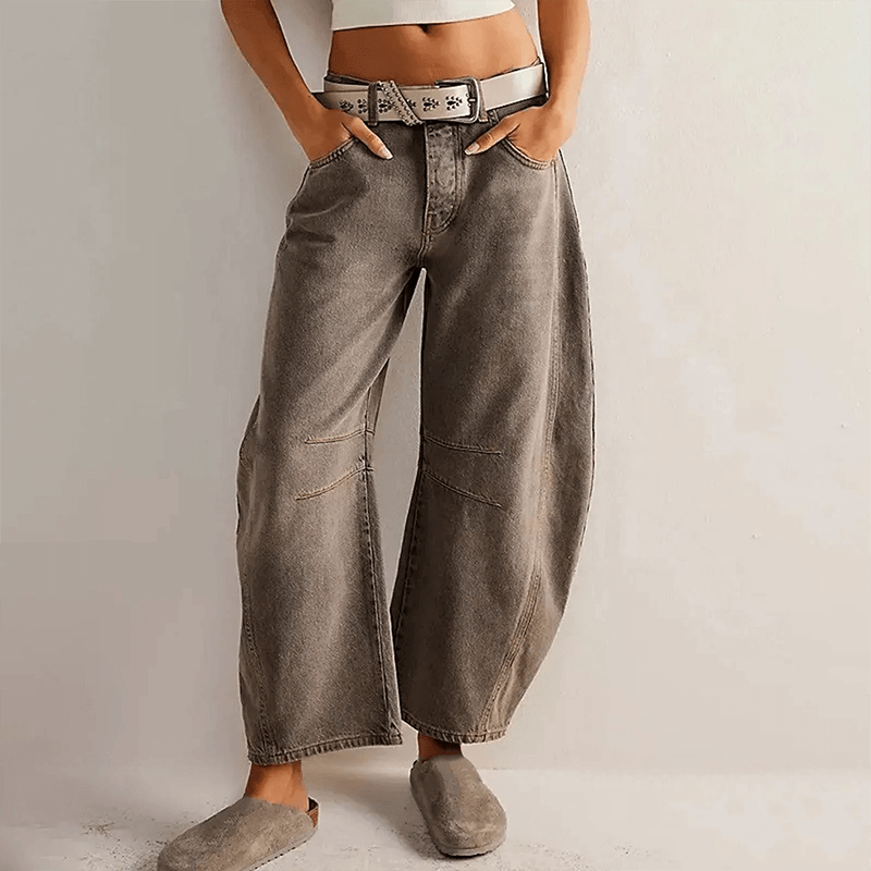 Grey high-waisted wide leg women's denim jeans, fashionable & versatile for a relaxed modern look.