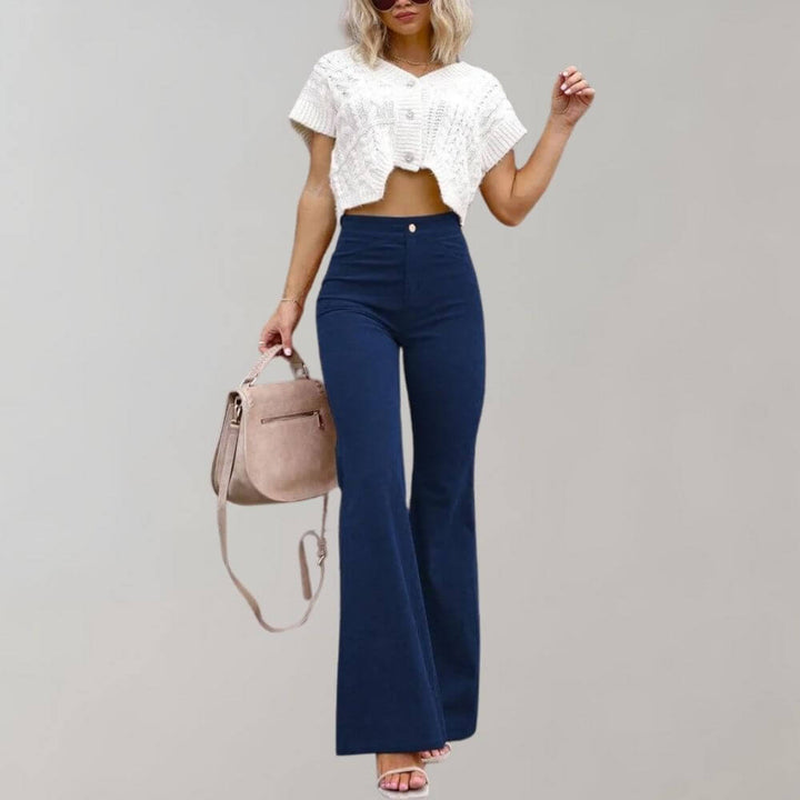 Close-up of the high-waisted detail on stylish women's wide leg trousers, designed for a comfortable fit.