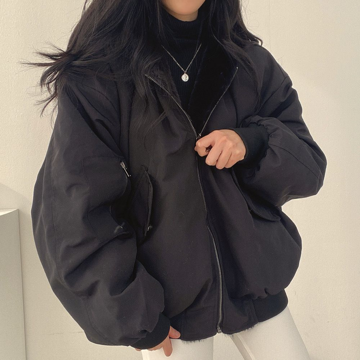 Stylish Isla women's reversible hooded jacket, a warm and versatile piece for winter.