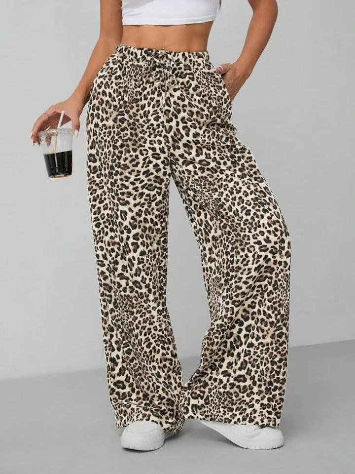 Summer style: women's flowy wide leg pants in a trendy leopard print. Perfect for warm weather casual fashion.