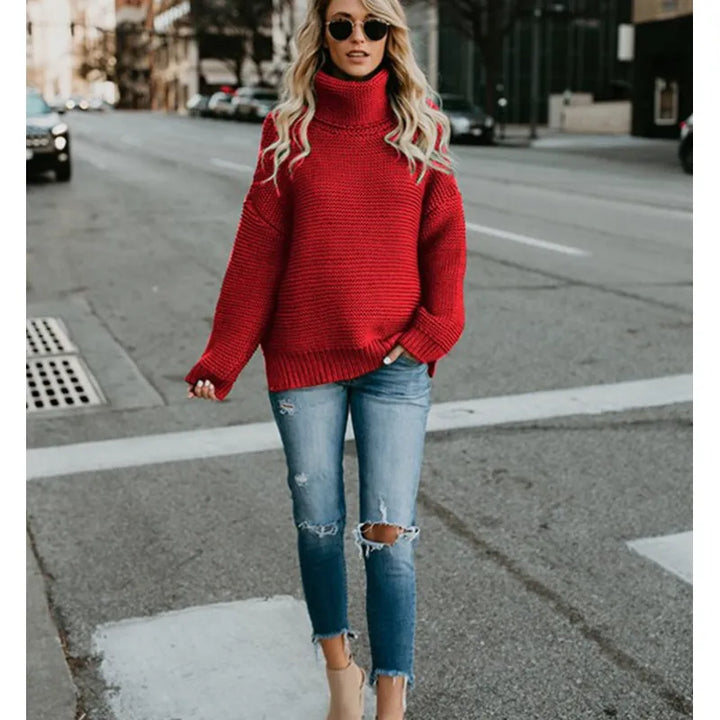 Oversized long sleeve women's knit turtleneck sweater. Relaxed style, ideal for cozy winter fashion.