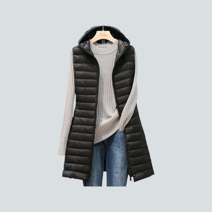 Versatile women's long quilted puffer vest, a fashionable sleeveless outerwear choice for chic winter looks.