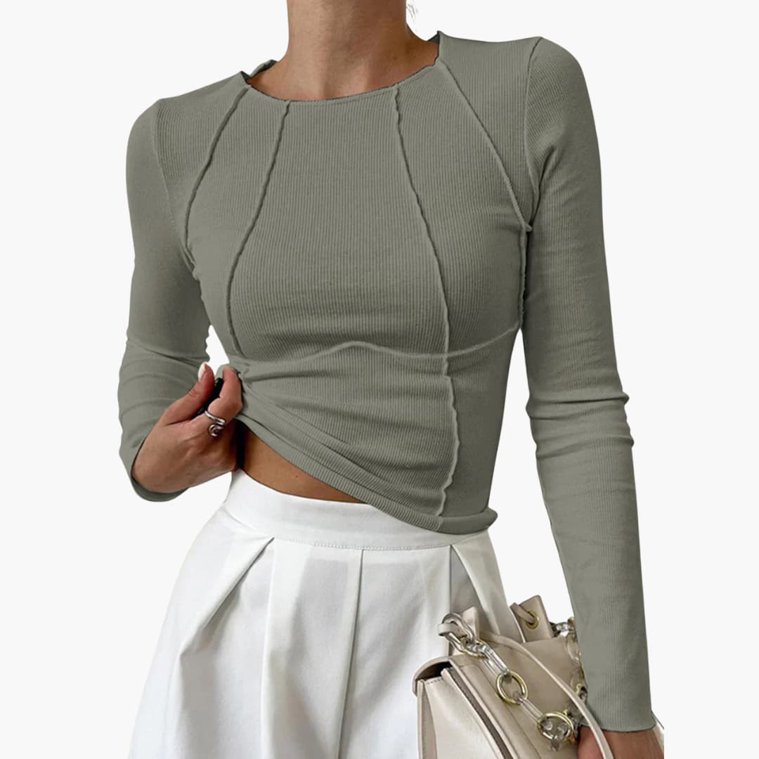 Elegant women's sculpted seam long sleeve top, providing a polished and stylish look for everyday fashion.