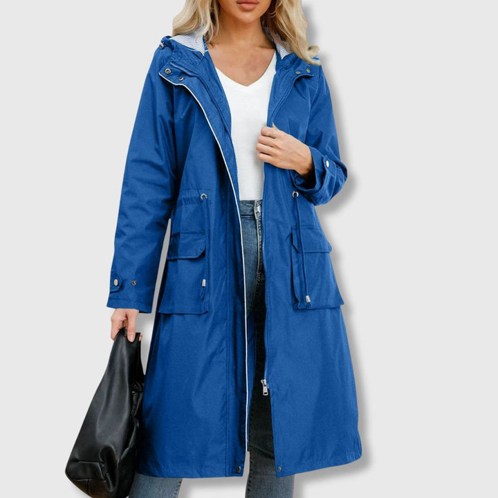 Stylish women's long hooded rain coat, waterproof with a full zip. Everyday fashion outerwear for wet weather.