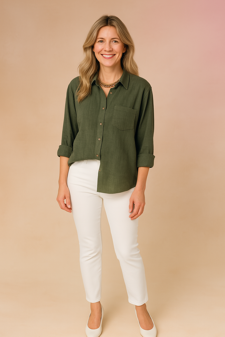 Effortless women's loose fit button-up shirt. Chic long sleeve blouse with pocket for comfortable everyday style.