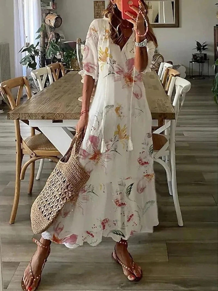 Versatile women's Luna long boho dress, leaf & stripe pattern. Maxi length, V-neck, perfect for spring & summer.