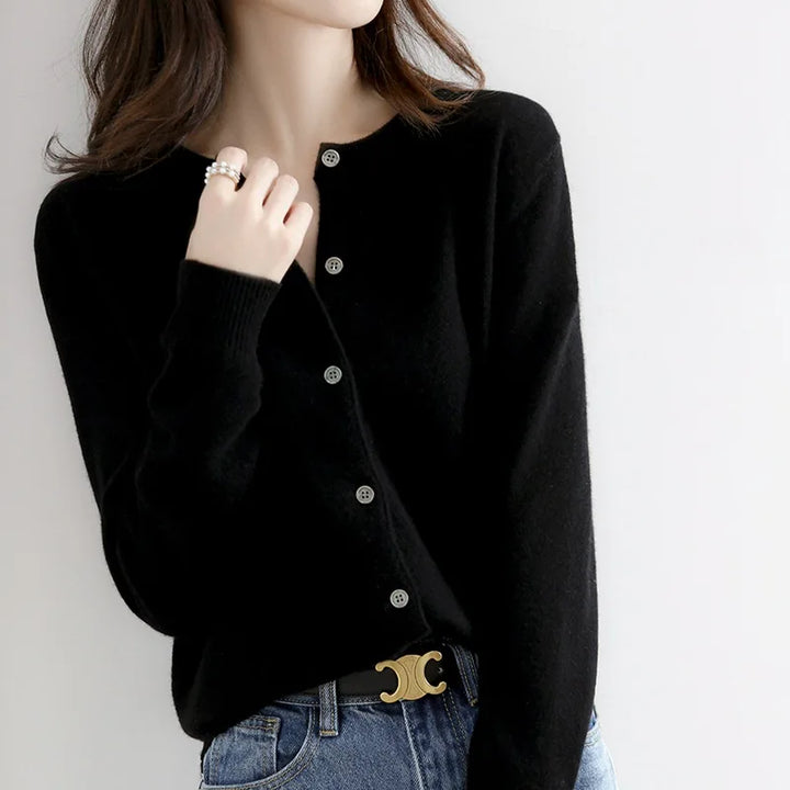 Women's luxurious soft cashmere button-up cardigan, perfect for elegant fall & winter fashion.