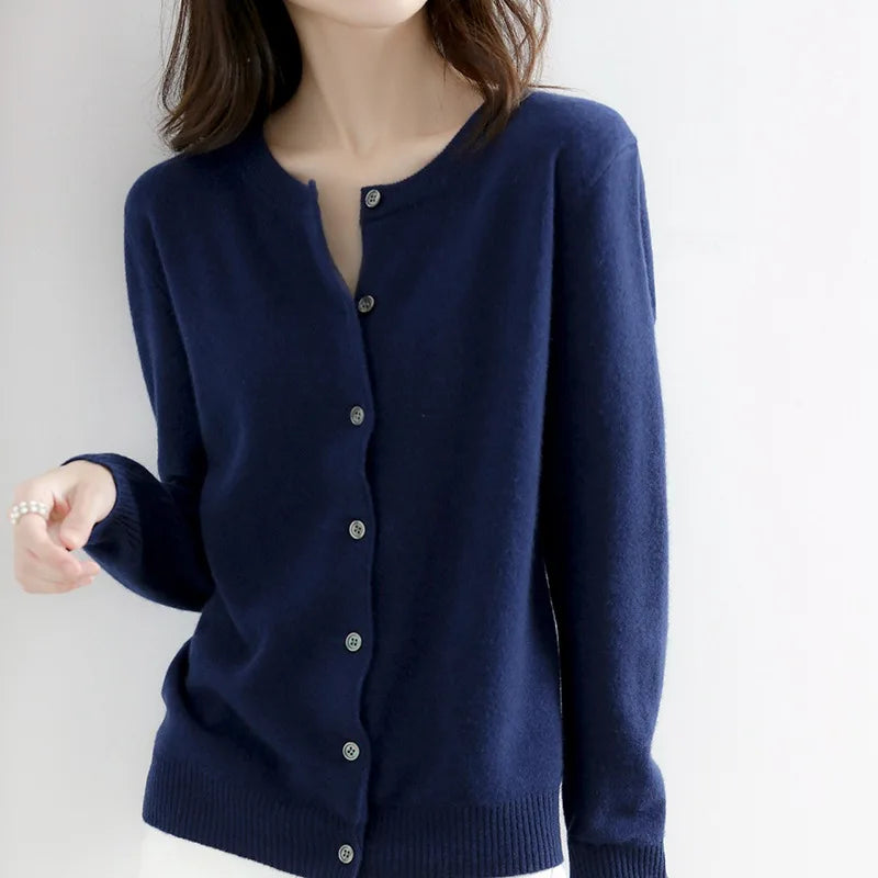 Elegant women's cashmere cardigan, a soft button-up sweater ideal for layering in cold weather.