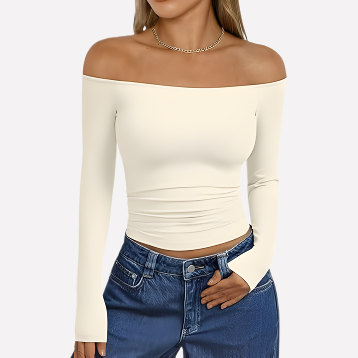 Stylish women's off-shoulder top with long sleeves, offering effortless fashion and comfort.