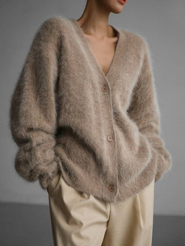 Versatile women's oversized cardigan with buttons. Comfortable long sleeve sweater for casual wear & layering.