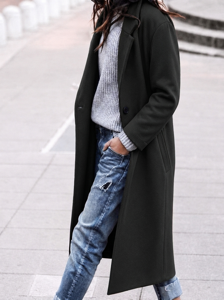 Versatile women's long trench coat, oversized fit, prominent lapel. A key piece of stylish fall/winter outerwear.