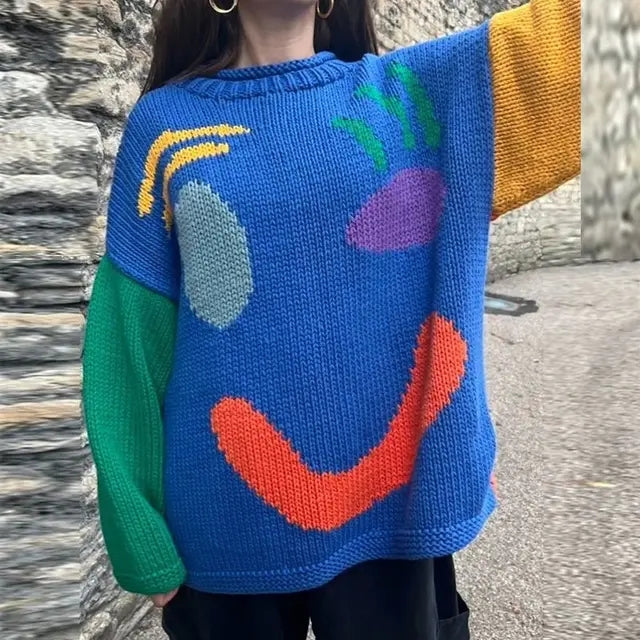 Stylish women's oversized smiley face pullover sweater, comfy knit for autumn layering.