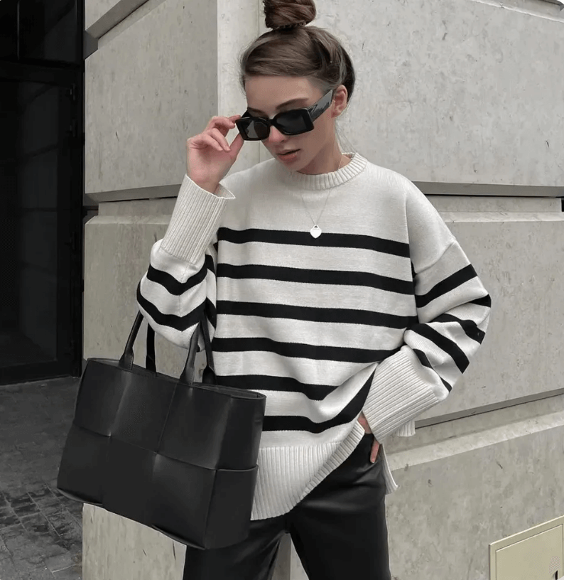 Comfortable crew neck oversized women's striped knitted jumper, a soft cotton blend sweater for stylish fall fashion.