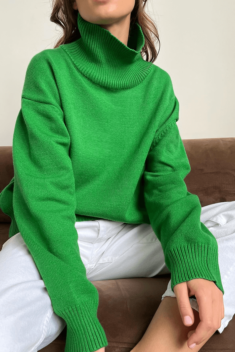 Relaxed fit women's long sleeve turtleneck jumper, a cozy and warm top for fall and winter comfort.