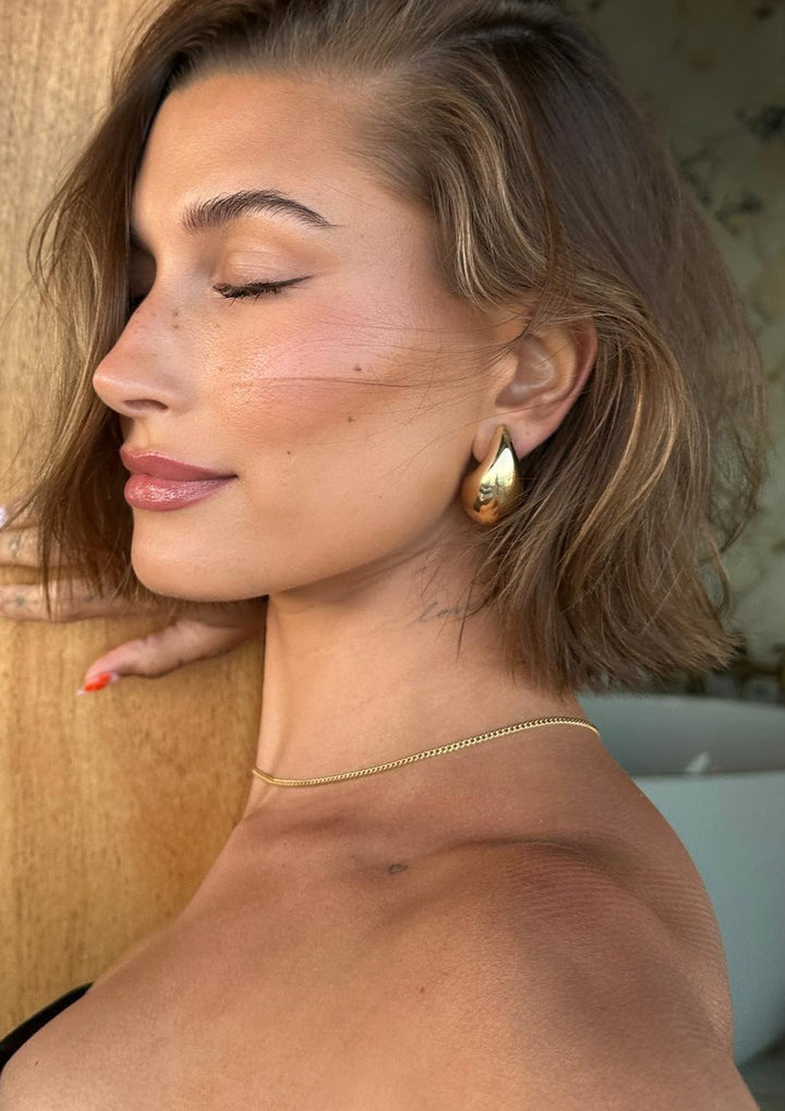Women's polished teardrop dangle earrings, elegant stainless steel jewelry for a sophisticated look.
