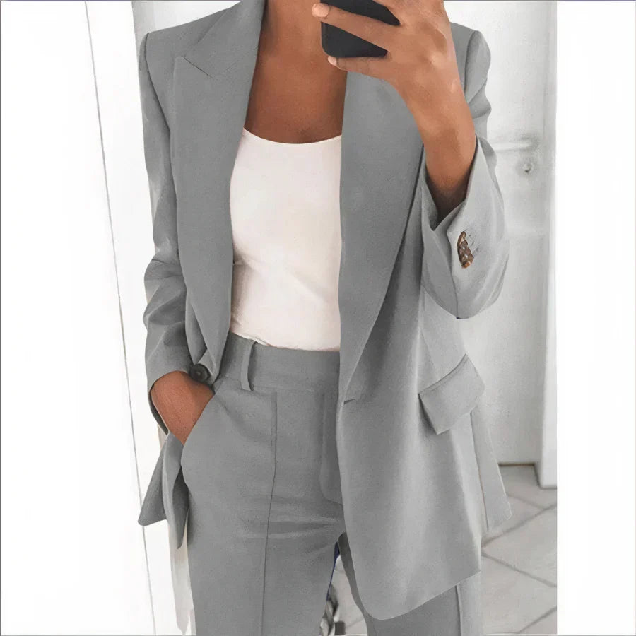 Chic women's tailored blazer and high-waisted pants set. A stylish two-piece outfit for spring and summer fashion.