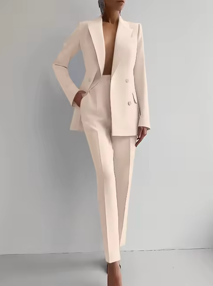 Tailored women's blazer, a key piece of a professional pantsuit for workwear and formal business outfits.