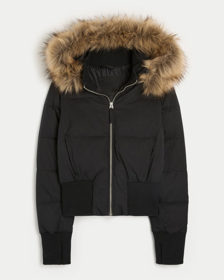 Durable women's quilted winter jacket offering superior insulation and a stylish removable hood for comfort.
