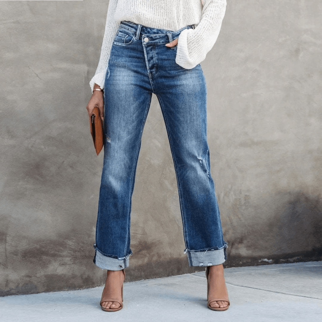 Women's relaxed fit blue jeans with trendy irregular waist detail, perfect for casual everyday fashion.